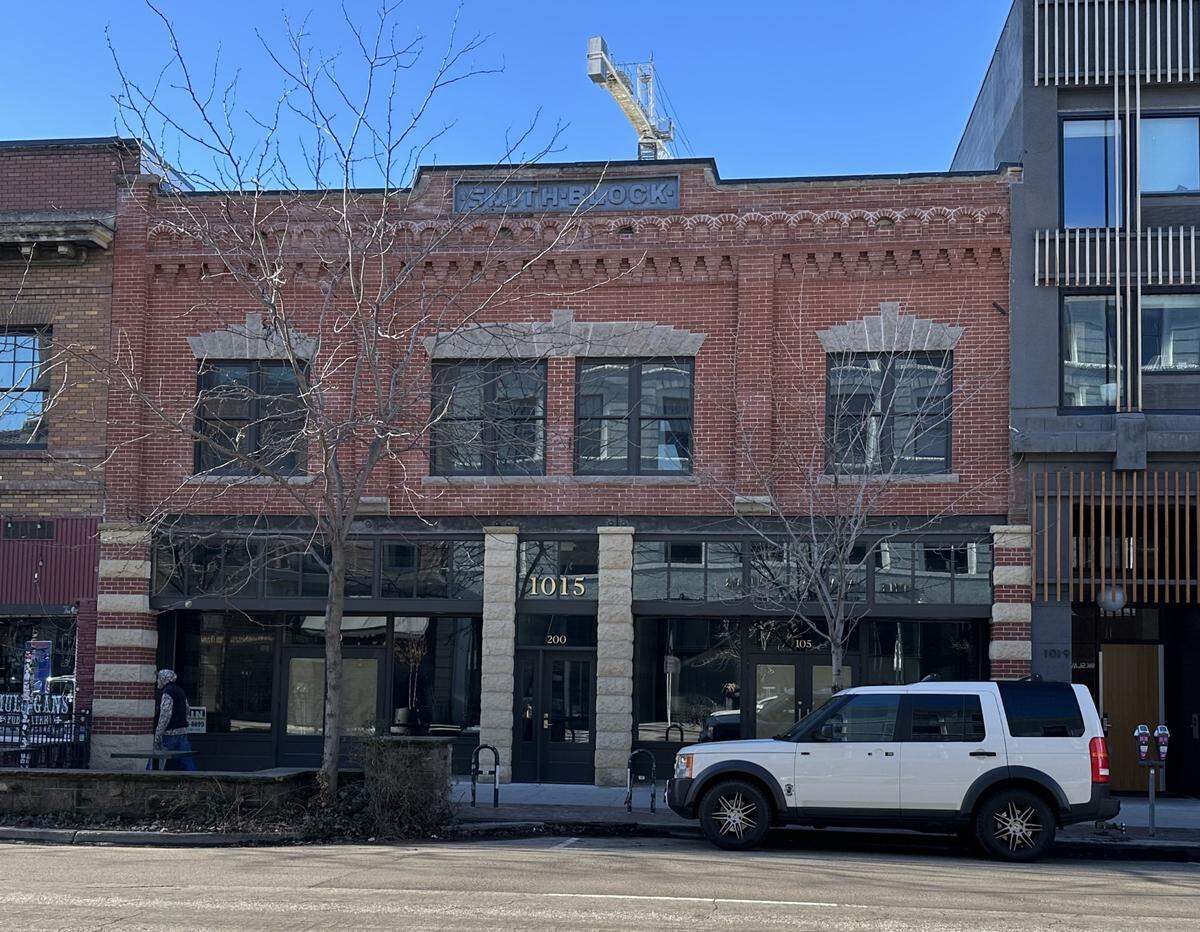 This is what the Smith Block building looks like today, after building owner Jade Stacey restored the front to look like it did when it was built in 1905. Restoration of the facade included brick and sandstone restoration, parapet wall work, new windows, new retail storefront entry locations and a restoration of a middle entry and staircase to the second floor, which was original to the building but was demolished and sealed off somewhere along the way. Stacey also cleaned up the “Smith Block” sign at the top of the building so that it’s actually readable now.