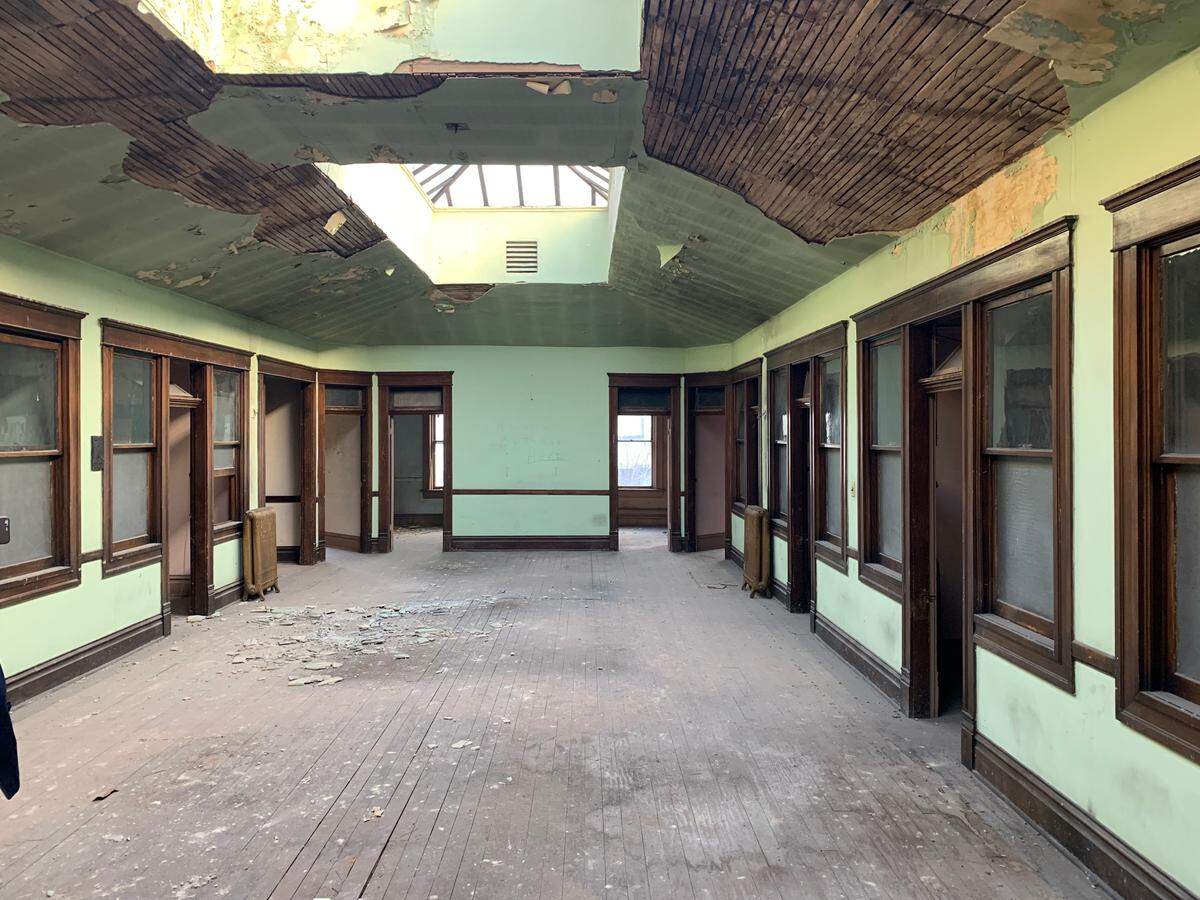 This photo shows what the second floor of the Smith Block building looks like with the skylights exposed, bathing the whole space in daylight. New owner Jade Stacey intends to keep all the individual rooms and all the original wood trim.