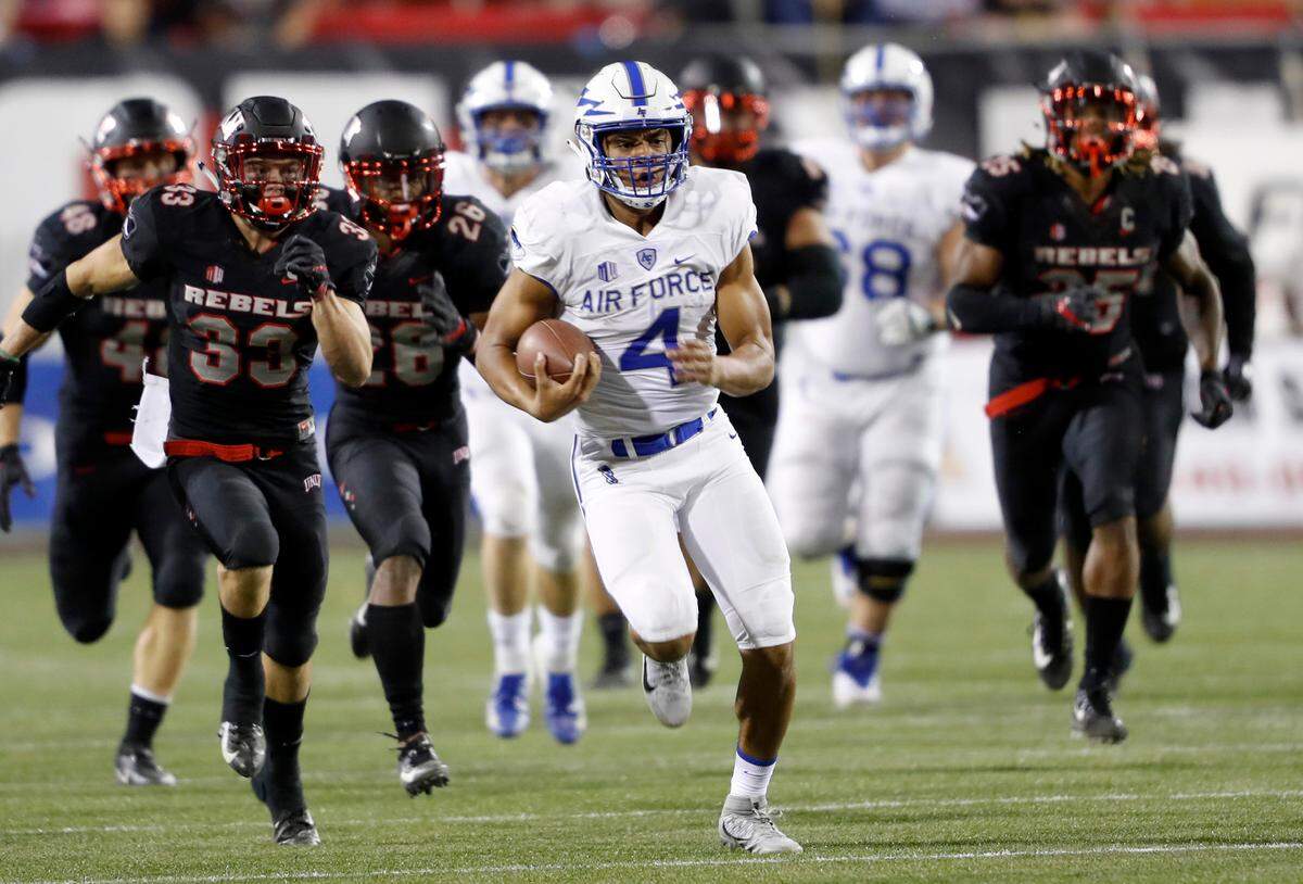 Air Force quarterback Isaiah Sanders (4) carries the ball on a quarterback keep during the second half against UNLV at Sam Boyd Stadium in Las Vegas last Friday.