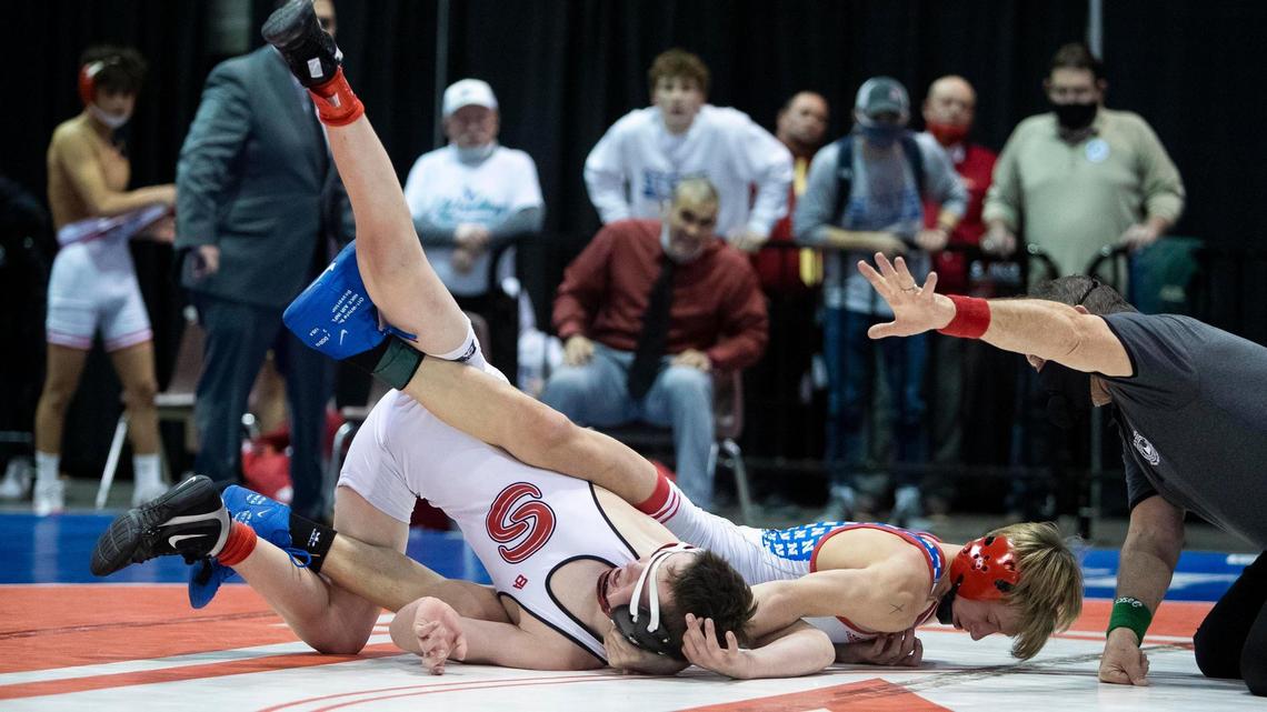 Nampa’s Carson Exferd, right, scores a near fall during his 4A state championship win over Shelley’s Carter Balmforth last year.