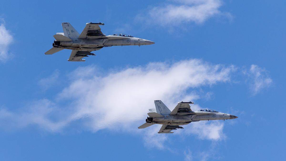Two E/A-18G “Vikings” Growler aircrafts fly during the Gunfighter Skies Air Show at Mountain Home Air Force Base, Sunday, May 17, 2026. The two planes were involved in a mid-air collision incident All four Navy pilots parachuted from the aircrafts during the crash.