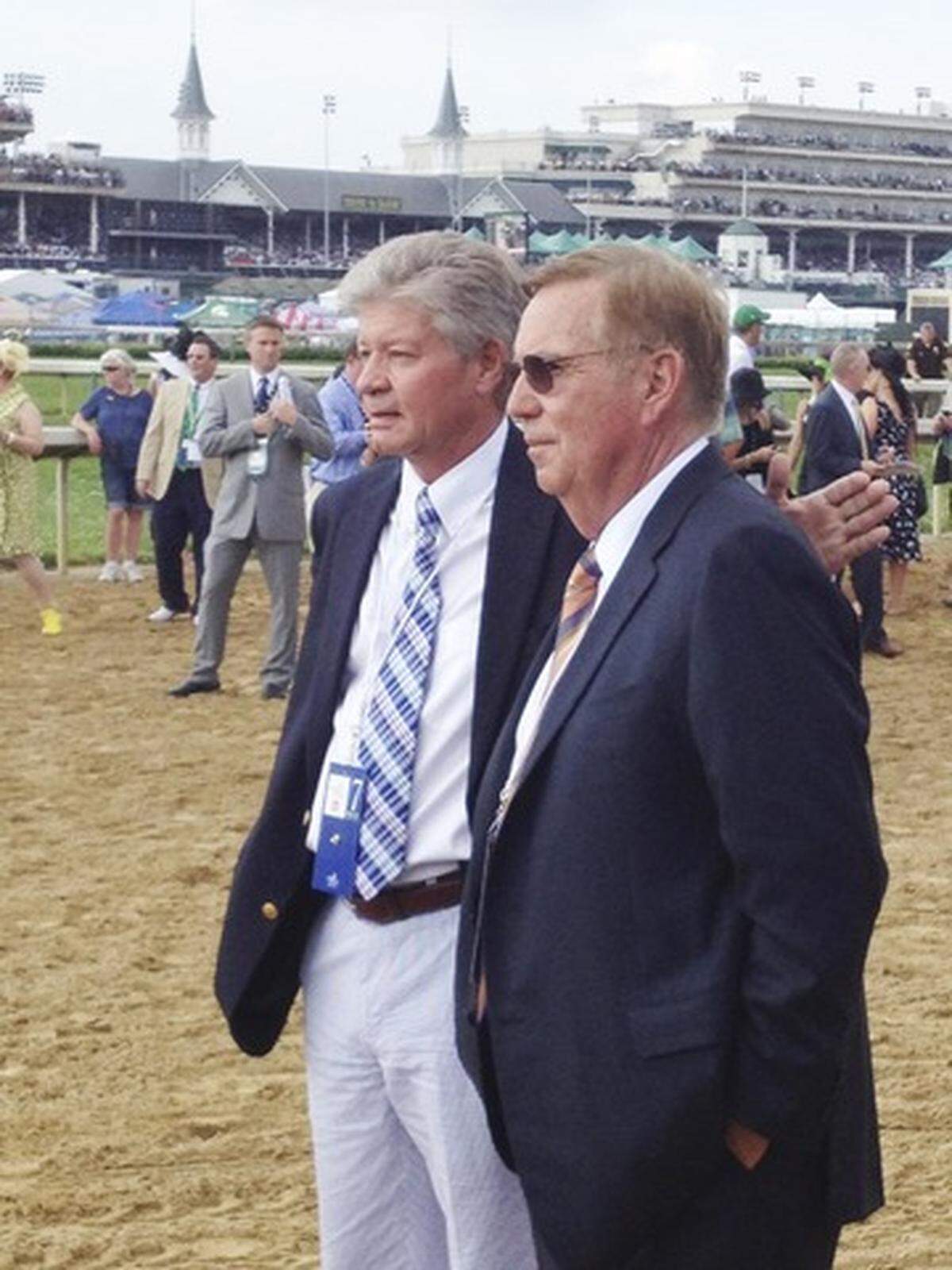 Idaho businessman Larry Williams, right, gets a pat on the back from longtime friend and former business partner Mike Johnson before Williams’s Rousing Sermon raced in 2012 at the Kentucky Derby.