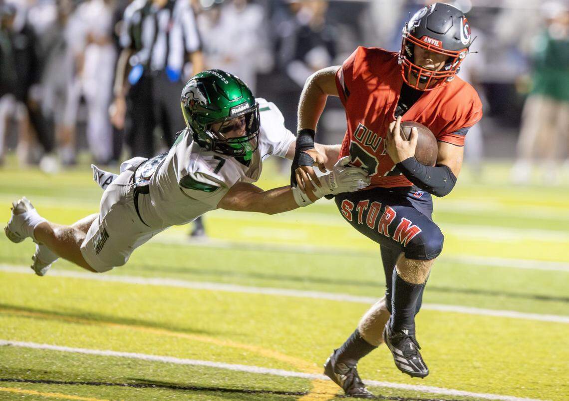 Owyhee running back Ellis Stanley breaks a tackle attempt by Eagle high linebacker Anthony Butler during the game at Owyhee High School in Meridian, Friday. Oct 3, 2025. Eagle defeated Owyhee 34-20.