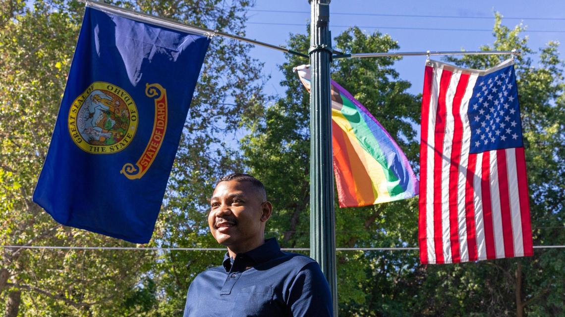 Jordan Hall is one of the volunteers who places Pride flags in the median along Harrison Blvd. in Boise.