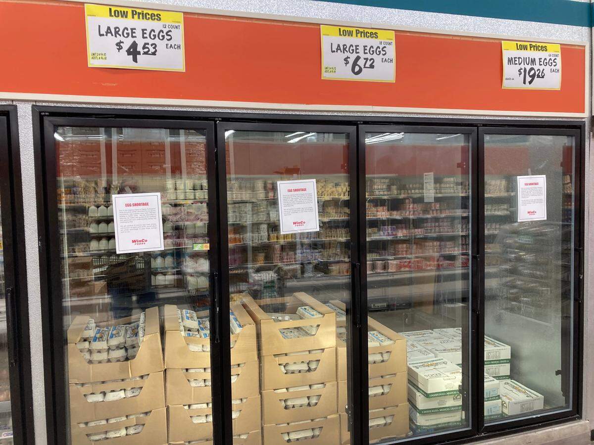 Signs at the WinCo Foods store on Fairview Avenue in Boise on Jan. 4 tell customers that bird flu is causing the price of eggs to go up.