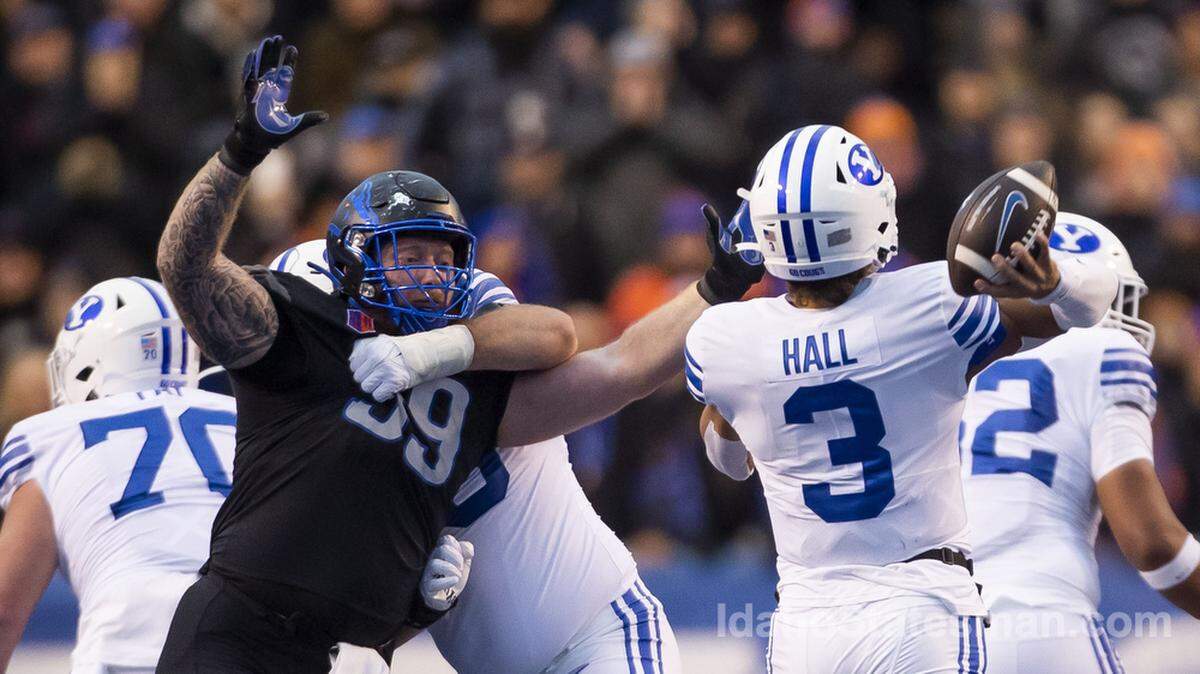 Boise State defensive tackle Scott Matlock pushes to get to BYU quarterback Jaren Hall, Saturday, Nov. 5, 2022, at Albertsons Stadium in Boise.