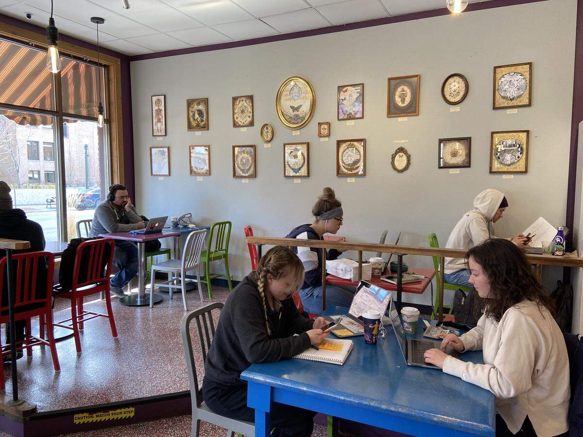 Emily Weber, left, and Paris Colton, right, study for their upcoming midterms at Boise State University at the Flying M Coffee House, 500 W. Idaho St., on Wednesday. Both have been cautious about leaving the house, but needed some space to focus. “I can only do so much at home without going nuts,” Colton said.