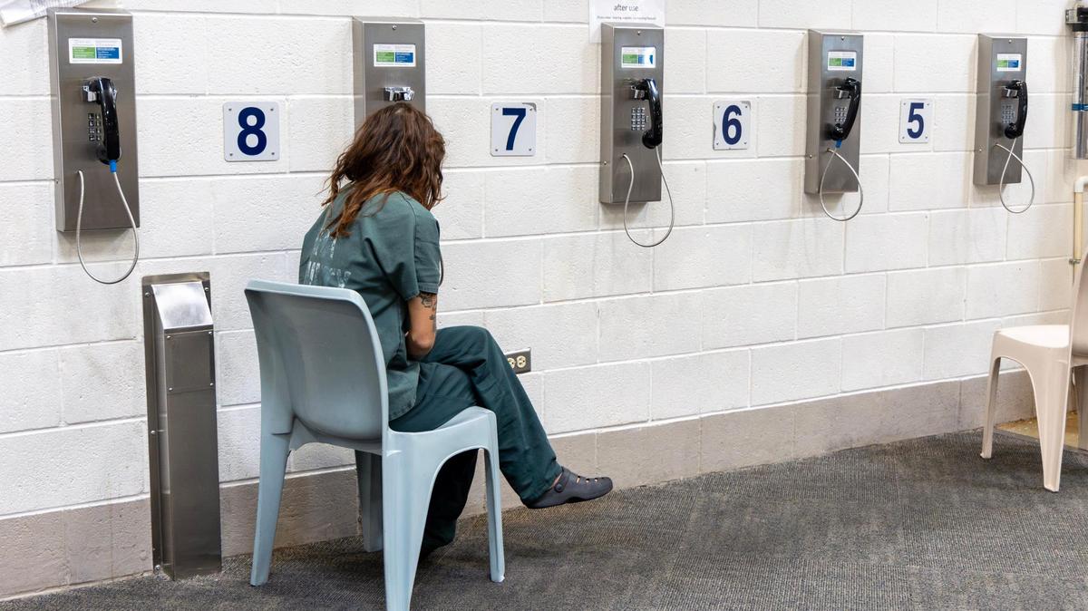 An inmate makes a phone call from the female dorms of the Ada County Jail. The Federal Communications Commission recently voted to dramatically increase the cost of prison and jail calls. 