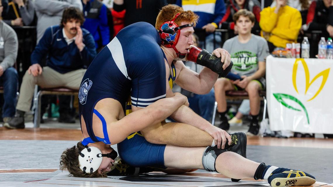 Meridian senior Cade White, right, rallied to beat Noah Holman of Washington’s Gonzaga Prep despite an early ankle injury in the 160-pound finals at the Rollie Lane Invitational at the Ford Idaho Center on Saturday.