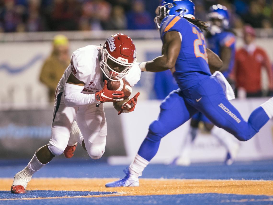 Fresno State defensive back Juju Hughes intercepts Boise State quarterback Brett Rypien in the end zone as running back Alexander Mattison is unable to get to the ball Nov. 9 at Albertsons Stadium in Boise.