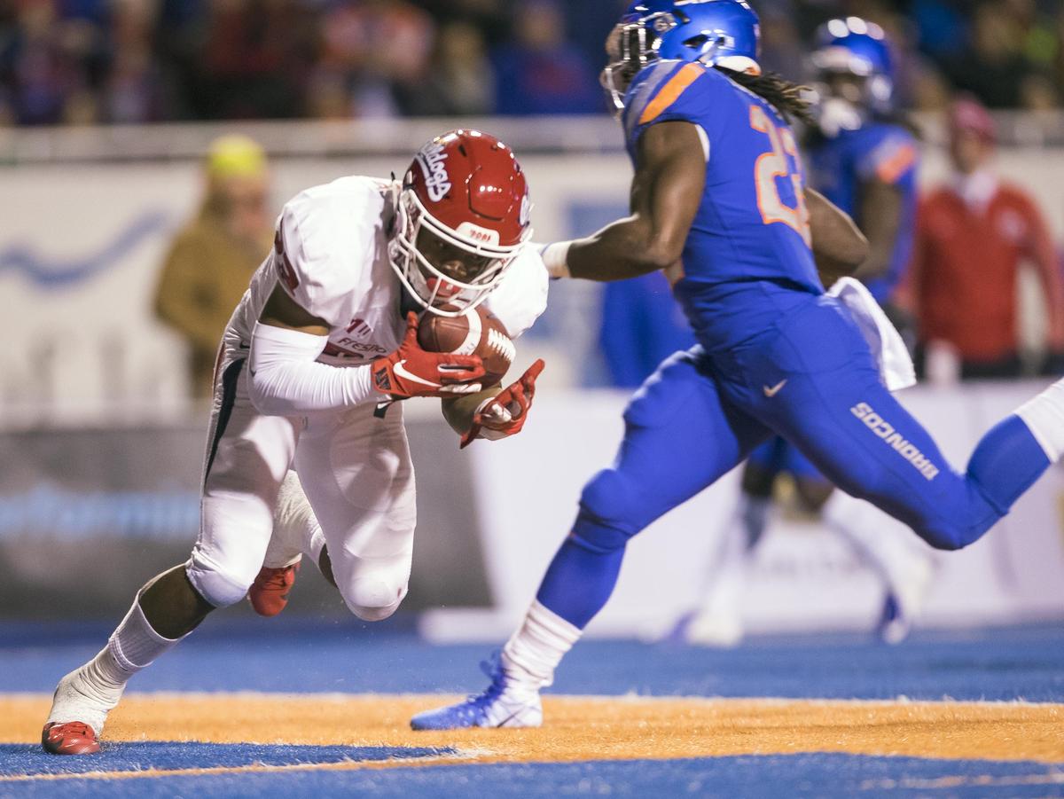 Fresno State defensive back Juju Hughes intercepts Boise State quarterback Brett Rypien in the end zone as running back Alexander Mattison is unable to get to the ball Nov. 9 at Albertsons Stadium in Boise.