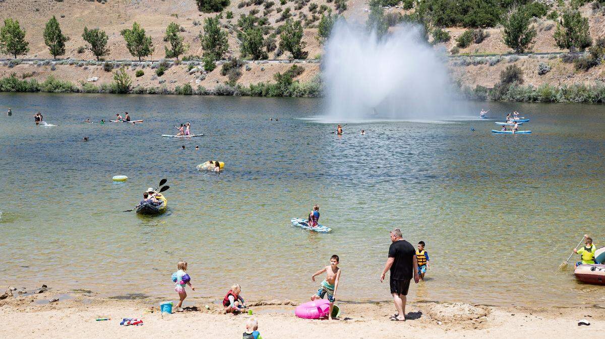 Hot enough for you? We’ve had an oven of scorchers, Nancy Napier writes. Adults and children cool down at Lucky Peak State Park’s Sandy Point Unit.