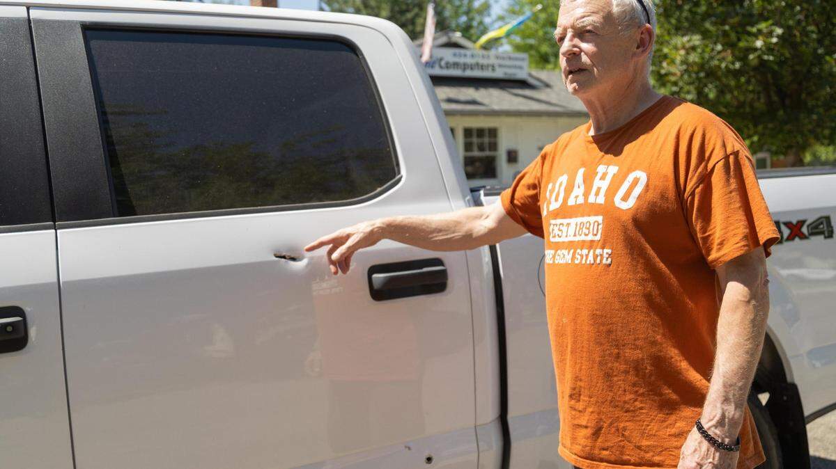 Keith Cox, 71, shows where his truck was struck by bullets during Wednesday night’s shootout in the North End that left a suspect dead. Cox, whose house also was hit, lives and was parked on Washington Street.