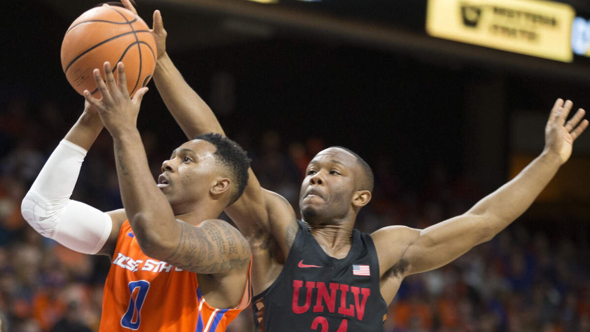 Boise State’s Marcus Dickinson drives past UNLV’s Jordan Johnson on Feb. 3, 2018, at Taco Bell Arena in Boise. The Broncos won 93-91 in overtime.