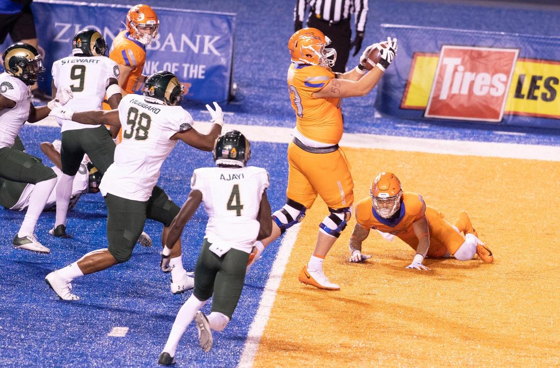 Boise State offensive lineman Nick Crabtree (73) catches a fumble by Boise State wide receiver Khalil Shakir (2) end the end zone for a touchdown during the game against Colorado State University at Albertsons Stadium. Boise State defeated CSU 52-21. Thursday, Nov. 12, 2020.