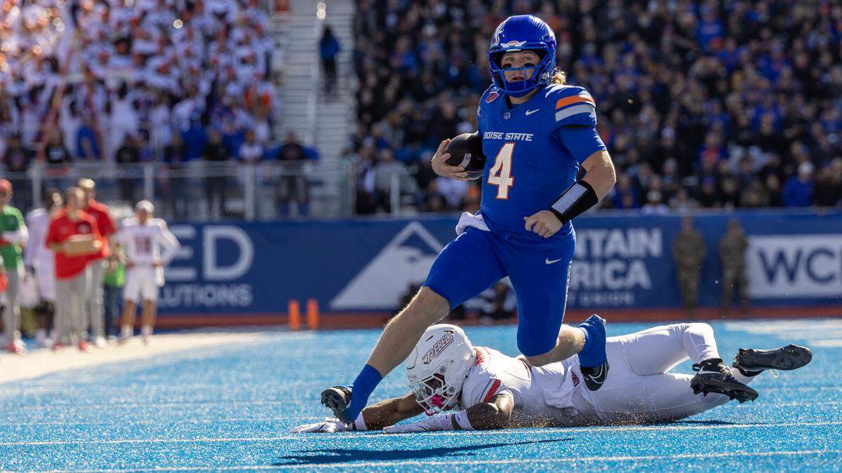 QB Maddux Madsen picks up yards in the red zone, evading UNLV linebacker Marsel McDuffie in the second quarter on Oct. 18 at Albertsons Stadium in Boise.