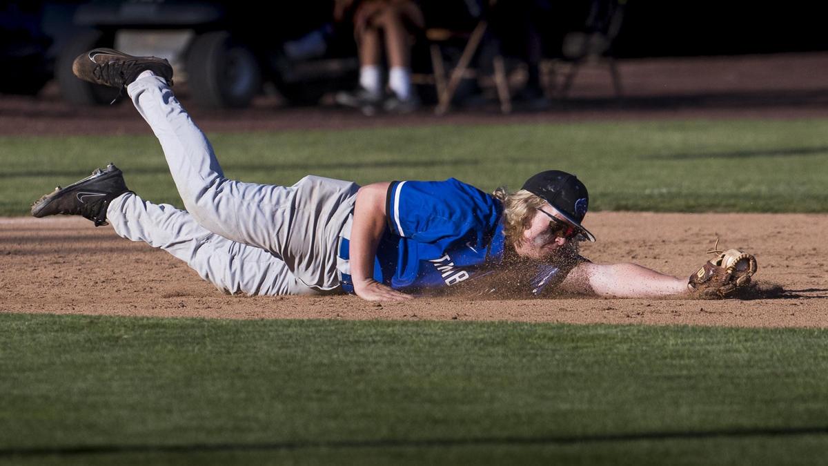 Timberline’s Layton Wagner makes a diving stop at third base last year during the 5A state semifinals.