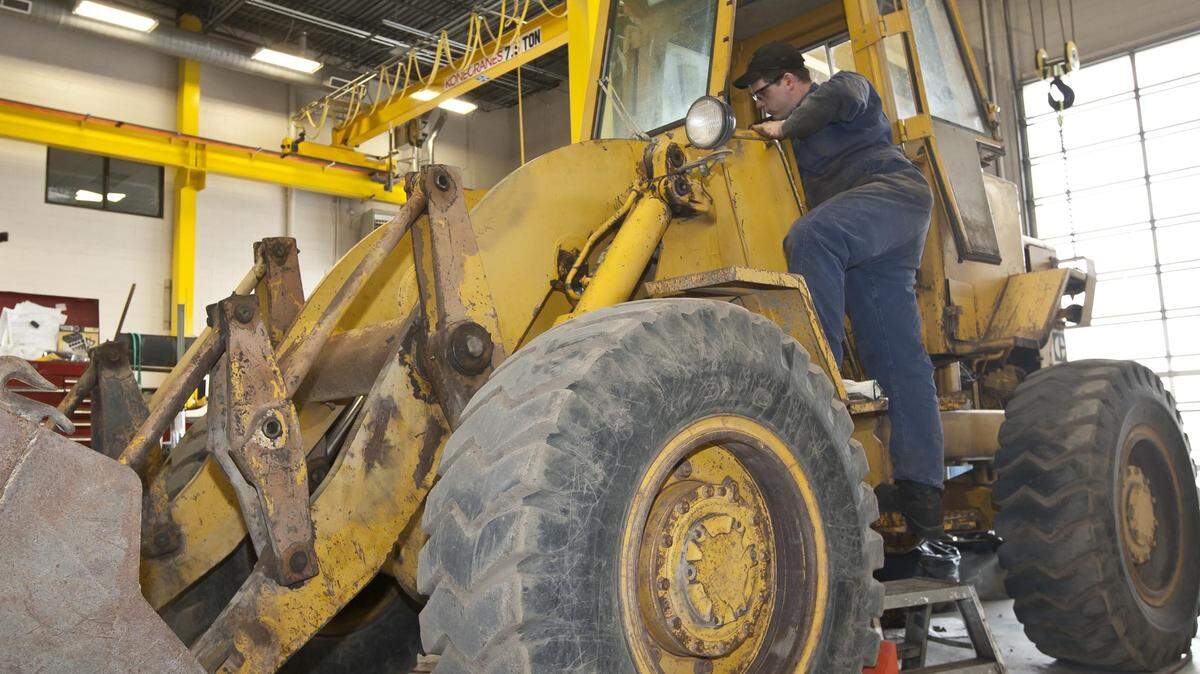 An employee works on a front loader at Western States Equipment Co. in Meridian. The Caterpillar sales and service chain, which has stores in several Northwest states, is owned by Boise's Terteling Co., which said Tuesday that it had fallen victim to an email phishing attack that may have put thousands of people's personal information at risk.