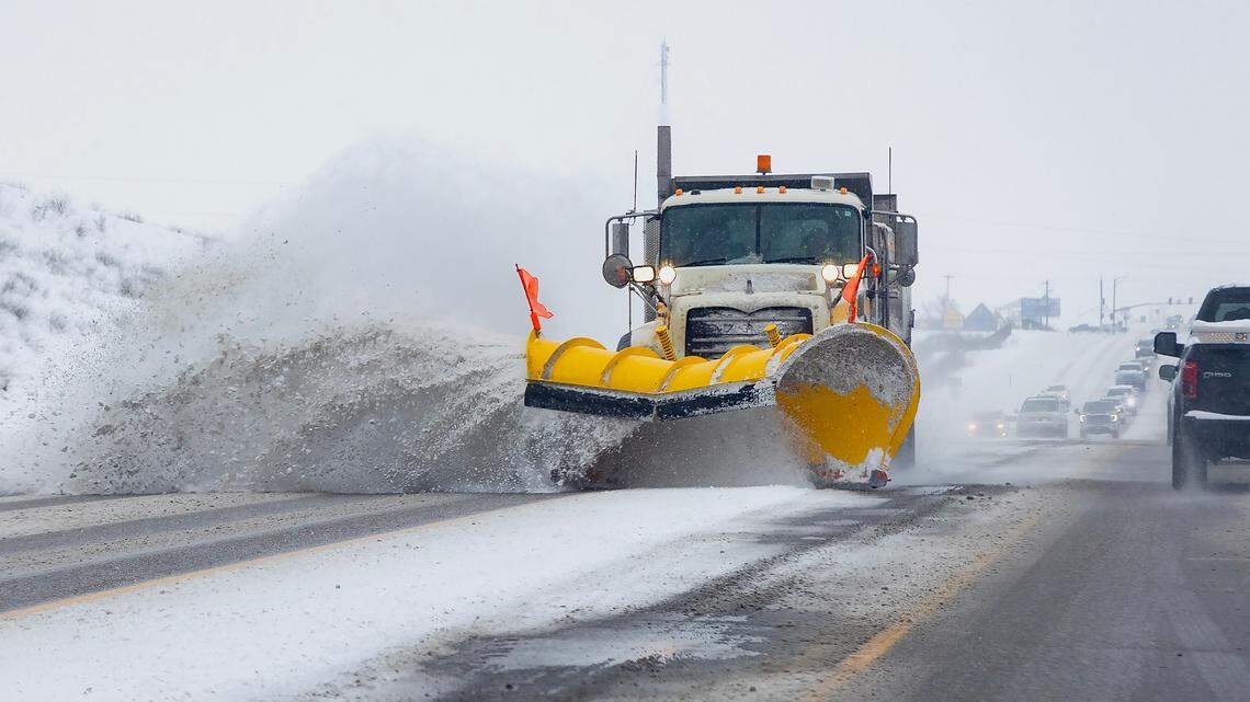 A plow removes snow from Meridian Road in Kuna on Jan. 17.