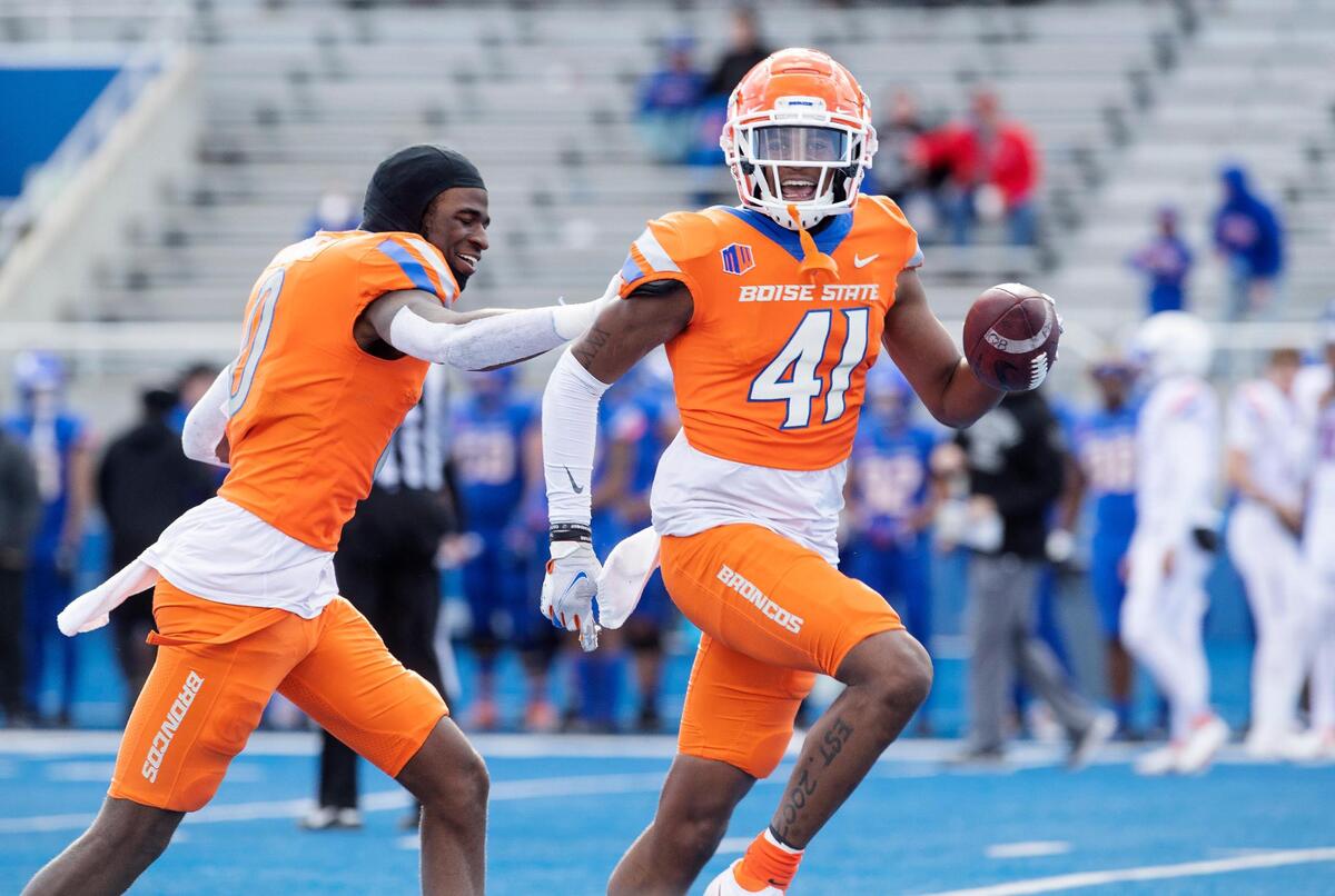 Boise State safety Jaylen Clark, right, celebrates his interception at the end of the fourth quarter with teammate JL Skinner during their spring game held on Saturday, April 9, 2022, at Albertsons Stadium.