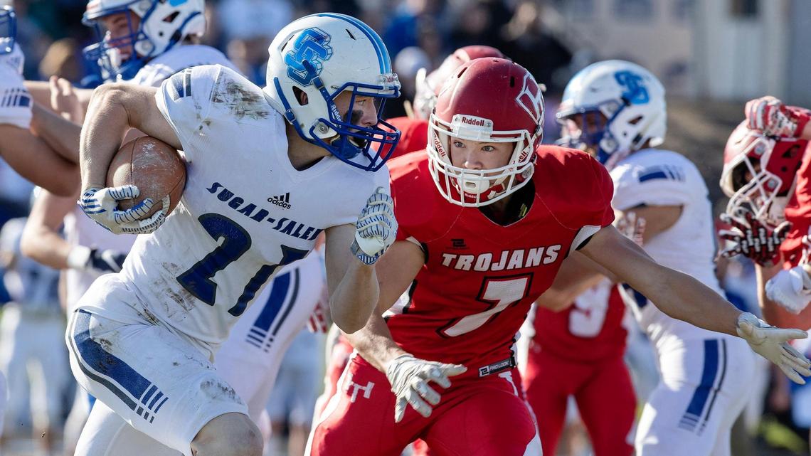 Homedale defensive back Jeffrey Layne tries to track down Sugar-Salem wide receiver Luke Aldrich on Saturday in Homedale. Sugar-Salem topped the Trojans 16-7 in the 3A state semifinals.