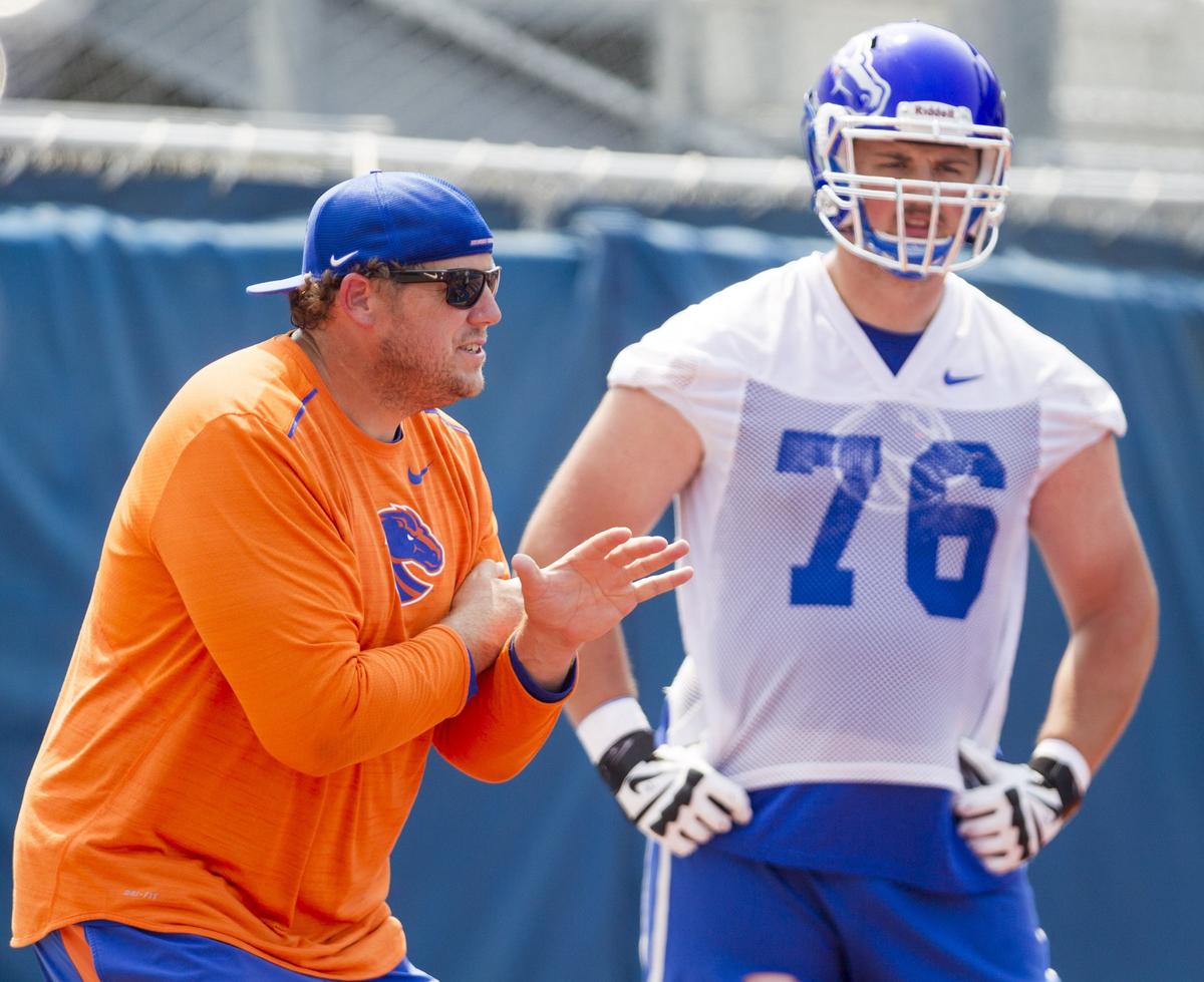 Boise State offensive line coach Brad Bedell, left, is under pressure to extract an improved performance from his group this week at Nevada. Left tackle Ezra Cleveland (76) has been a bright spot.