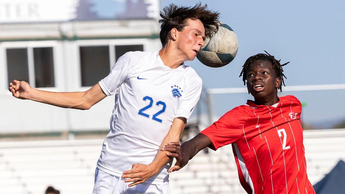 Timberline defender Joseph St. Pierre hits a header in a battle with Boise’s Ale Hoefer in the semifinals of the 5A boys soccer tournament Friday.