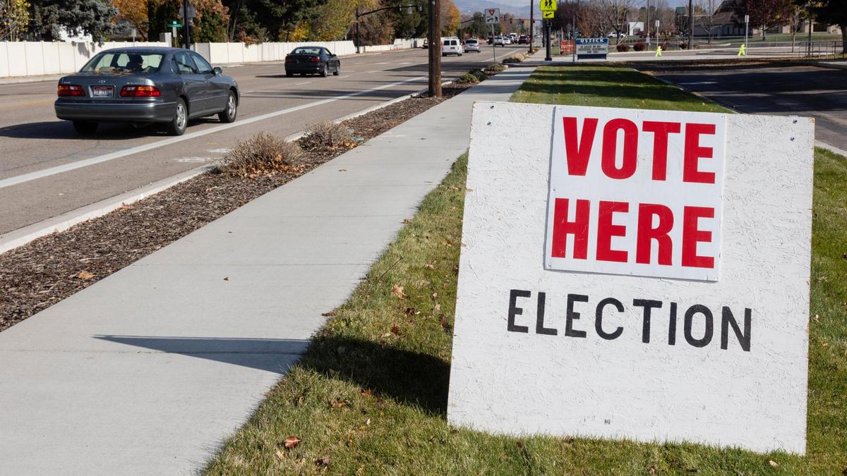 A sign draws voters in to the Ustick Elementary School polling location on Tuesday, Nov. 2, 2021.