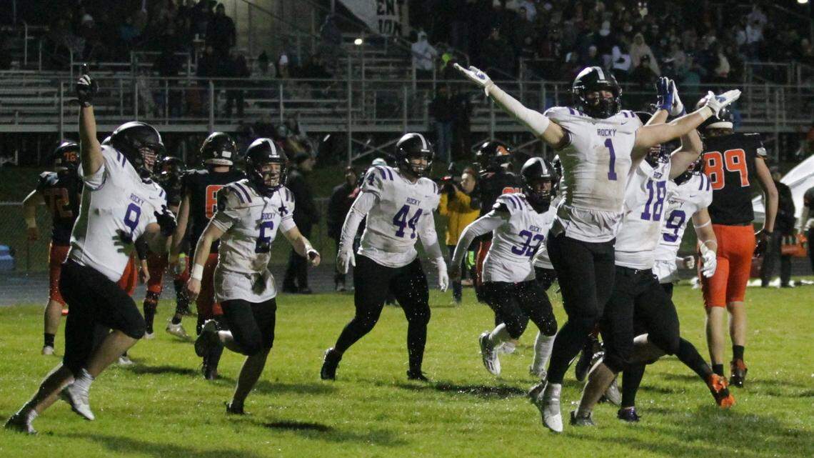 Rocky Mountain celebrates a safety forced by Gage Tanner (1) as the Grizzlies shut out Post Falls 22-0 on the road in the 5A state quarterfinals.