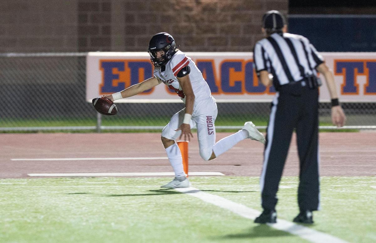 Owyhee quarterback Matt Irwin stretches for a touchdown against Borah last season. The junior returns as the Storm’s starting quarterback.