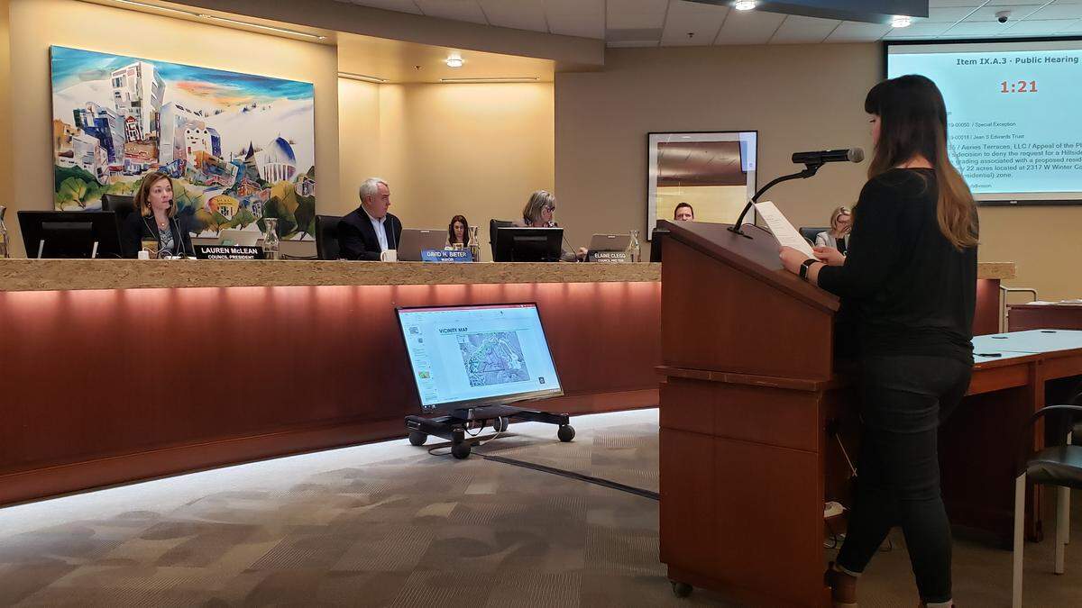 Boise resident Katie Nelson tells members of the Boise City Council how her home has sunk six inches in the seven years she and her husband have lived in it. They live on North Villa Ridge Way. “The proposed development is literally in my back yard and shares the same soil conditions and terrain as my home,” Nelson said.