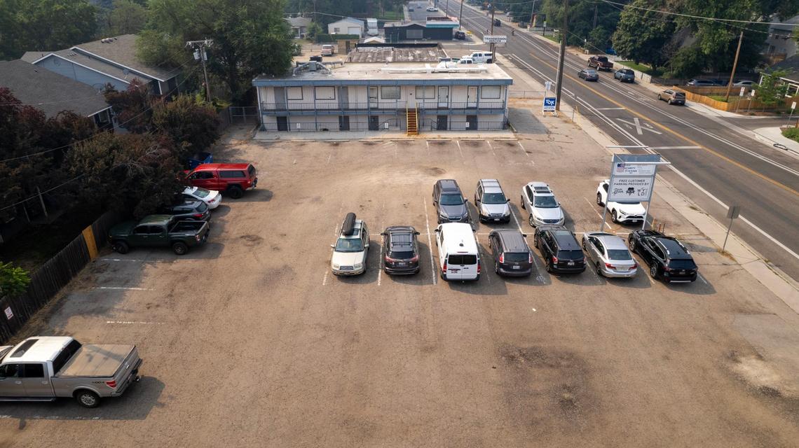 The aging office building on the south side of the lot would be demolished for the new apartments.