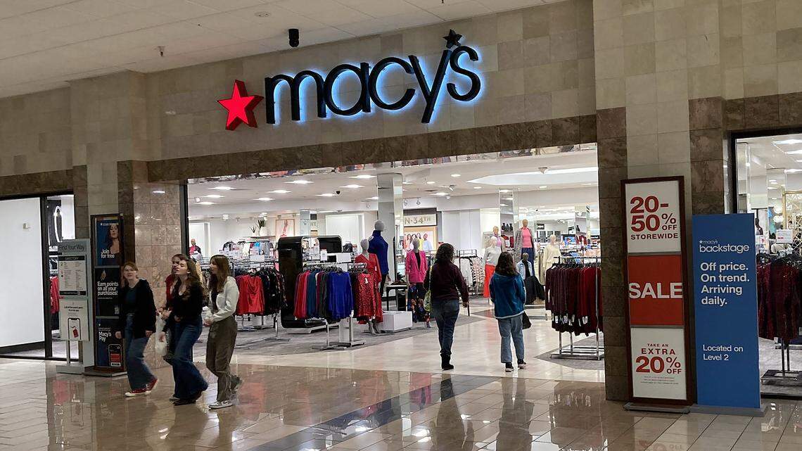 Shoppers at an entrance to the Macy’s department store in Boise Towne Square.
