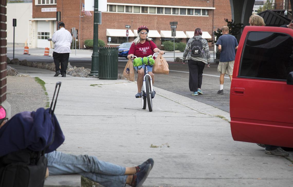 Riding her purple bicycle, her primary method of transportation, Traci Foy heads to Interfaith Sanctuary homeless shelter in Downtown Boise.