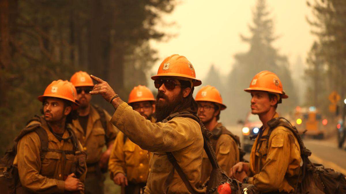U.S. Forest Service firefighters prepare to battle the Caldor Fire in Meyers, California, in 2021.