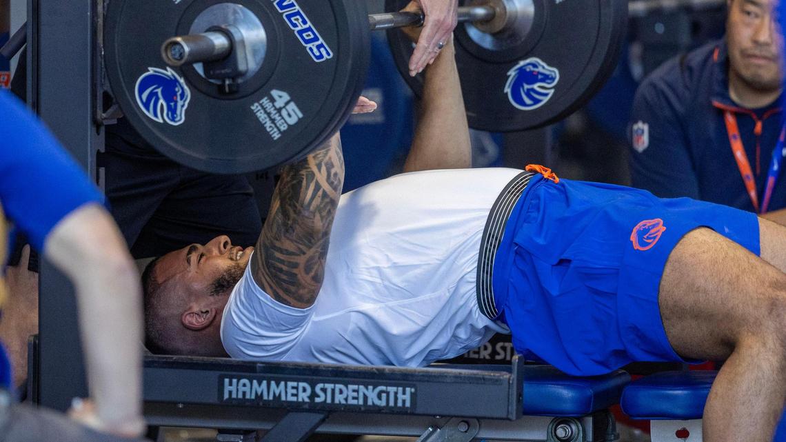 Boise State defensive lineman Ahmed Hassanein bench presses in front of a host of NFL scouts Wednesday at pro day in Boise.