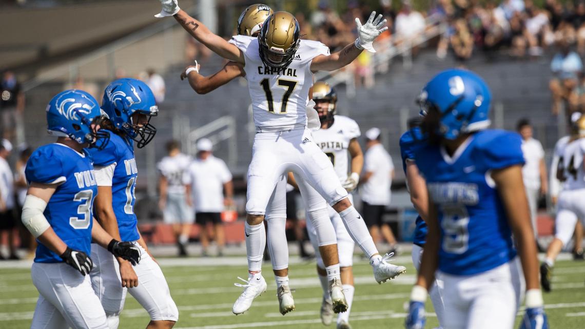 Capital wide receiver Jonah Blackham celebrates a touchdown reception with quarterback Carson Bohning in a 5A SIC game against Timberline Saturday, Sept. 7, 2019 at Dona Larsen Park in Boise.