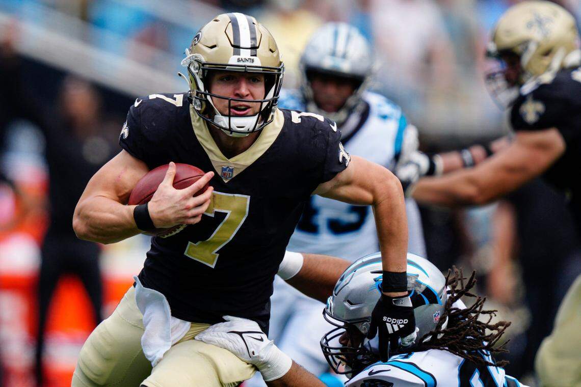 New Orleans Saints quarterback Taysom Hill runs the ball against the Carolina Panthers during the second half of their game Sept. 19 in Charlotte, N.C.