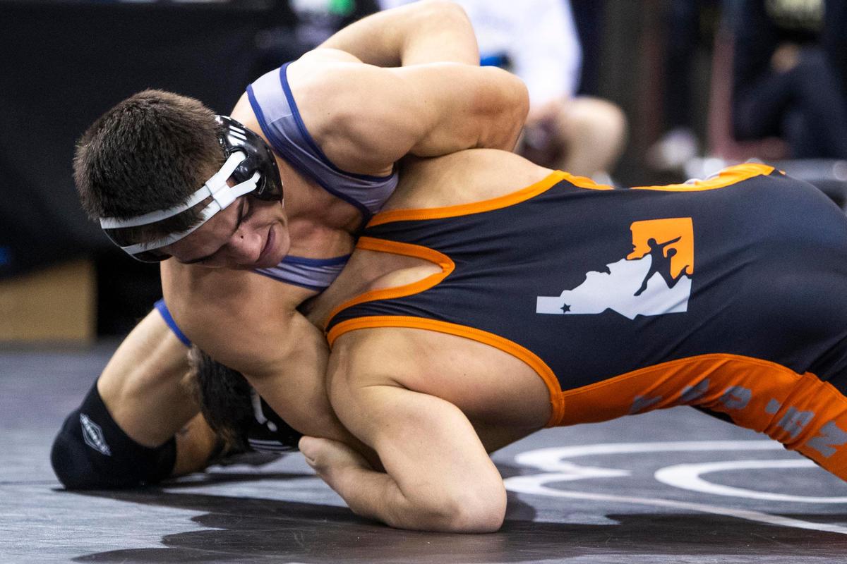 Breydon Morrill, Meridian, grapples with Isaac Jessen, Post Falls in the 5A 132-pound state wrestling championship Saturday, Feb. 29, 2020 at Ford Idaho Center in Nampa.