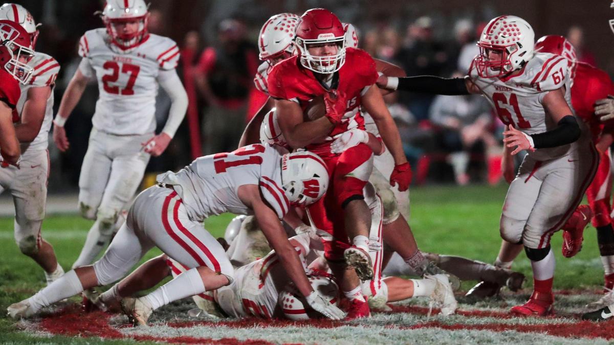 Homedale running back Hayden Kincheloe plows through Weiser’s defense on Oct. 15. The reigning 3A All-Idaho Player of the Year has the Trojans back in the 3A quarterfinals, where they host South Fremont on Saturday.