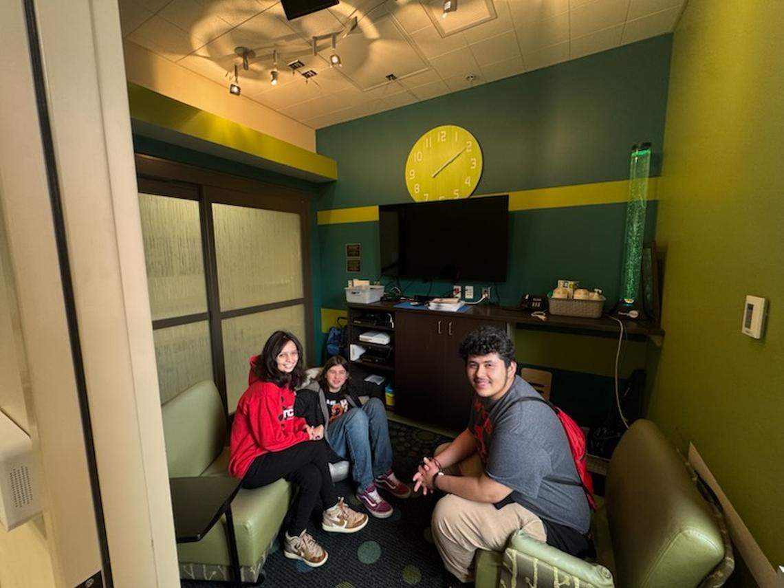 Meridian Technical Charter High School students Mar Bradford, Ethan Mensior, and Marco Duarte sit in the “teen room” at St. Luke’s Children’s Hospital in Boise. The students raised over $22,000 to go toward remodeling this room.