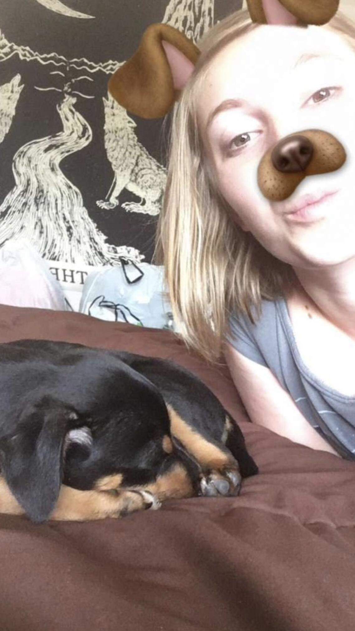 Airman Karlie Westall loved all animals and was interested in becoming a marine biologist. Here she is pictured with her dog, Joey.