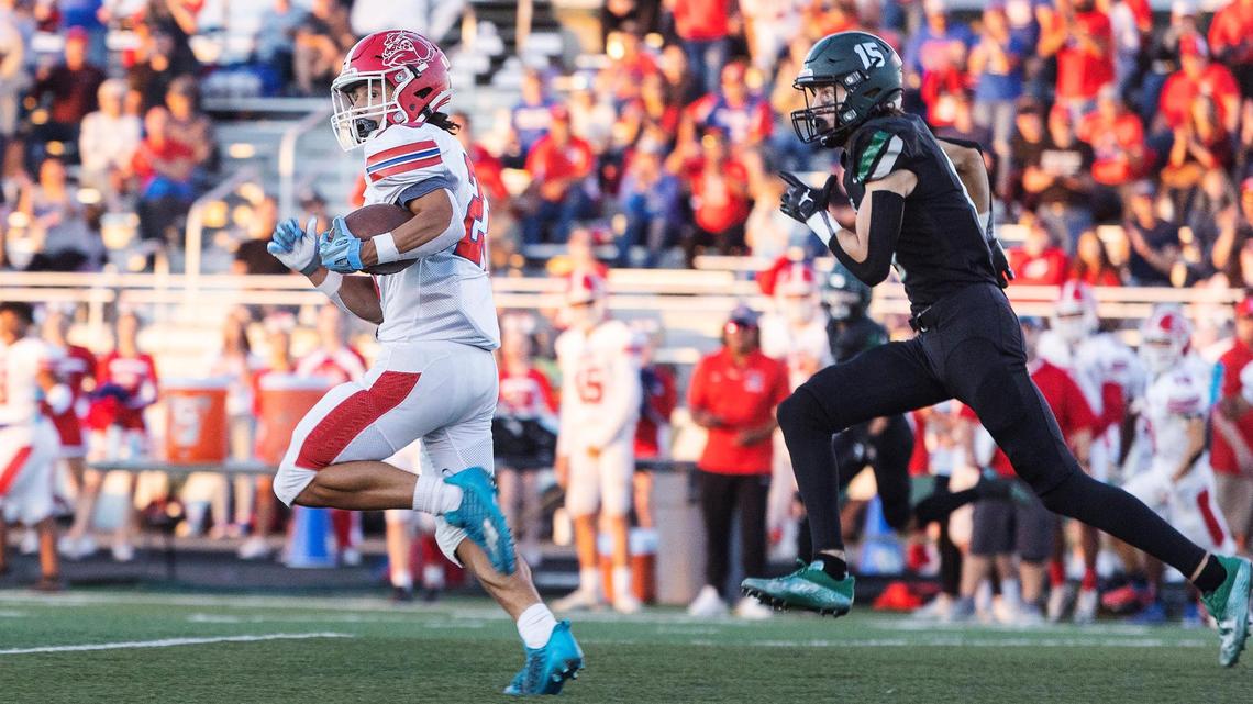Nampa wide receiver Dante Avjian slips past Eagle defensive back Dallas Sargent on Friday at Eagle.