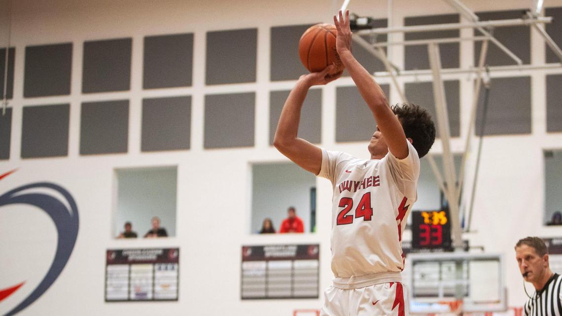 Owyhee senior Titus Bailey scores in the 5A District Three boys basketball tournament semifinals against Meridian, Tuesday, Feb. 21, 2023.
