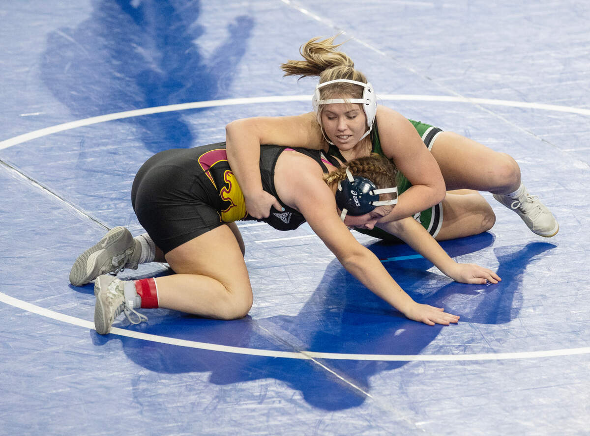 Eagle’s Jordynn LeBeau, right, will try to defend her state championship this week as the No. 1 seed a 185 pounds.