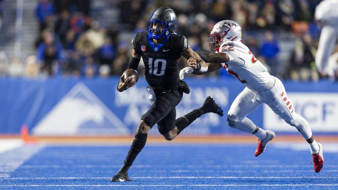 Former Boise State quarterback Taylen Green runs for a first down. Green spent his final two years in college at Arkansas.