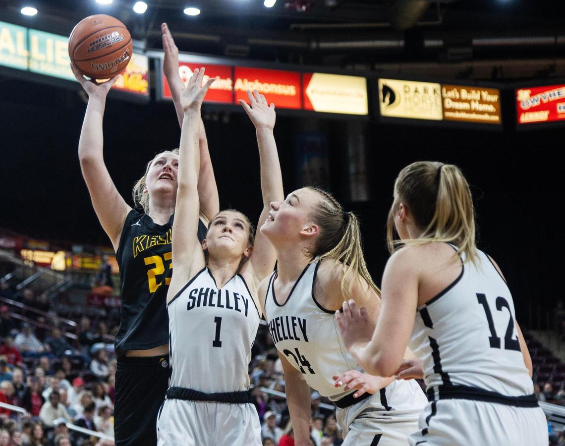 Bishop Kelly’s Addy Laible rises above the Shelley defense for a basket in the 4A state semifinals last year.