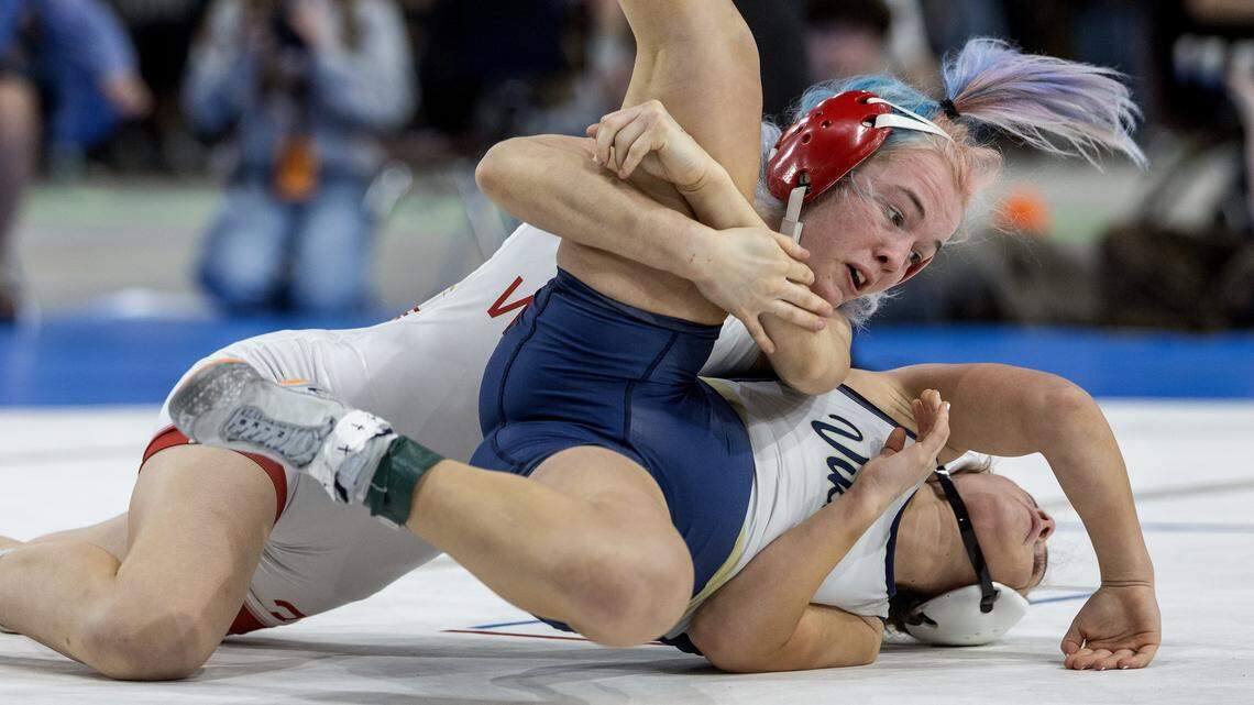 Weiser's Corianna Parsons, top, wrestles Middleton's Alivia Lombardo in the girls 105-lbs. division first place match at the Idaho state wrestling championships held at the Ford Idaho Center in Nampa, Saturday, Feb. 28, 2026. Parsons won.
