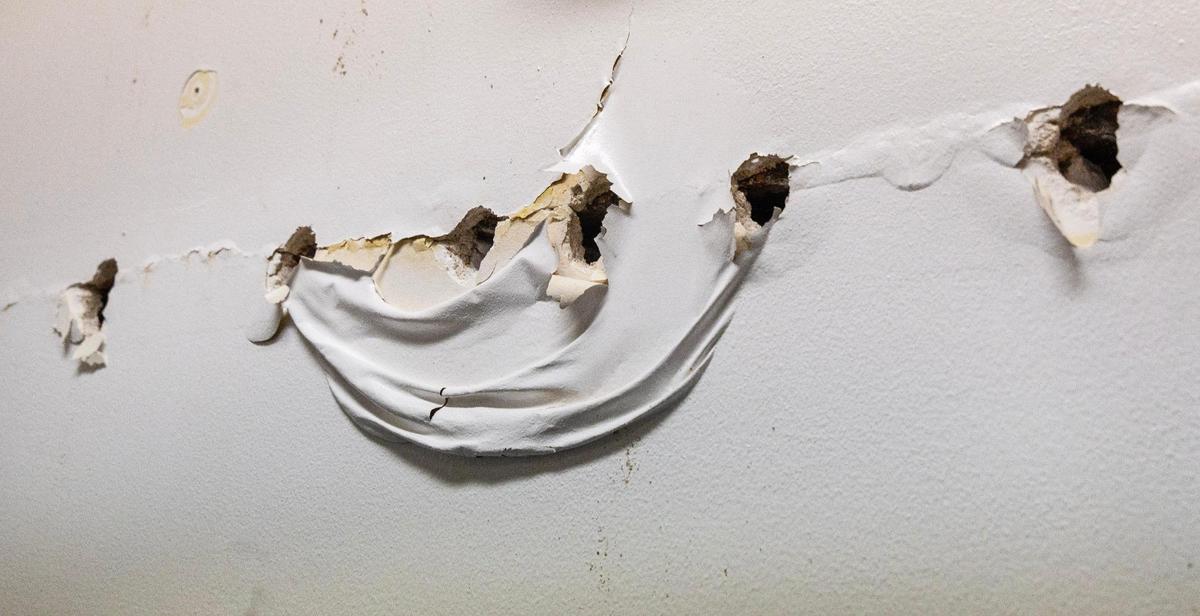 Holes were drilled into the walls to drain water from a flood in 2022.