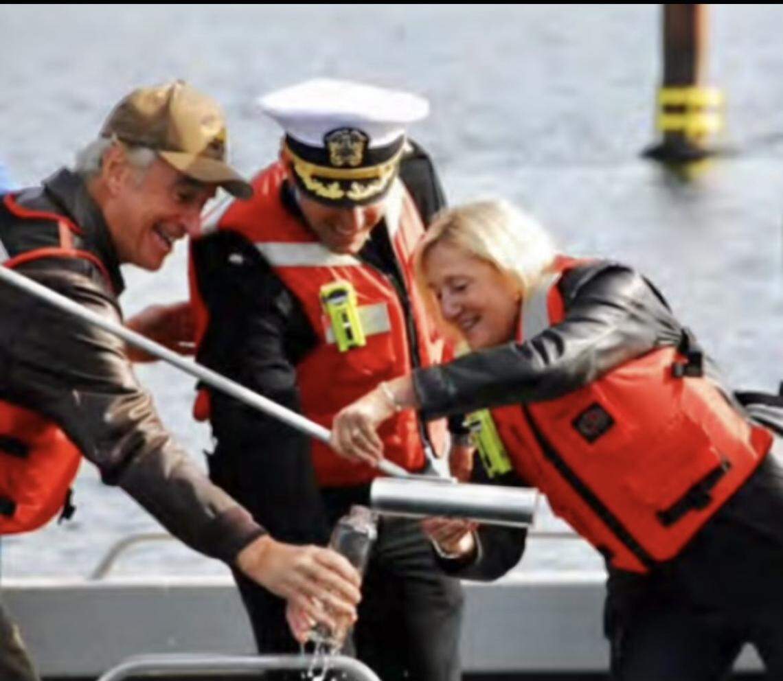 From left, former Idaho Gov. Dirk Kempthorne, then-Cmdr. Nicholas Meyers and ship sponsor Terry Stackley collect water from an Idaho lake to be used during the March 16 christening ceremony of the USS Idaho. Water from four Idaho lakes will be the first water to touch the submarine.